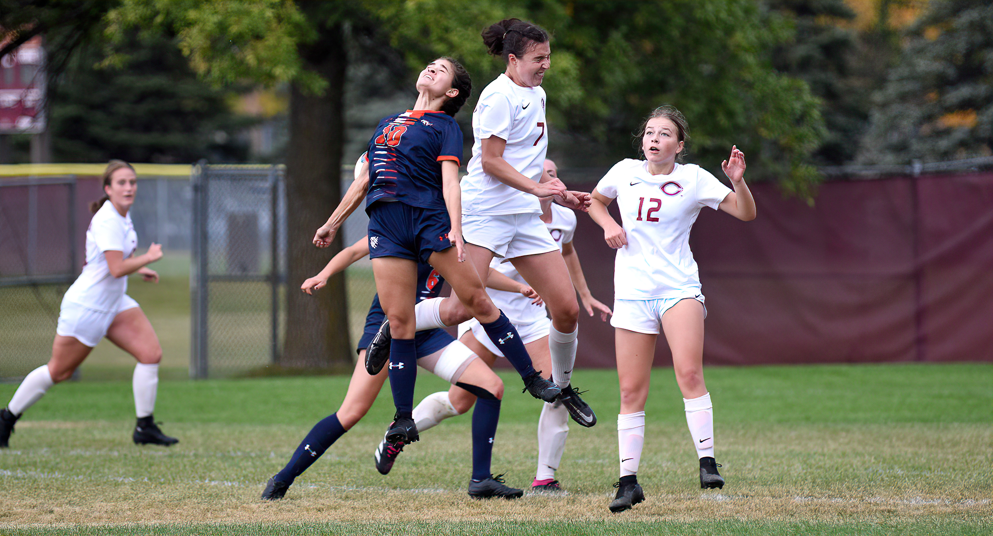 Emily Larsen (#7) goes high to win a ball in the air late in the Cobbers 1-0 win over Macalester.