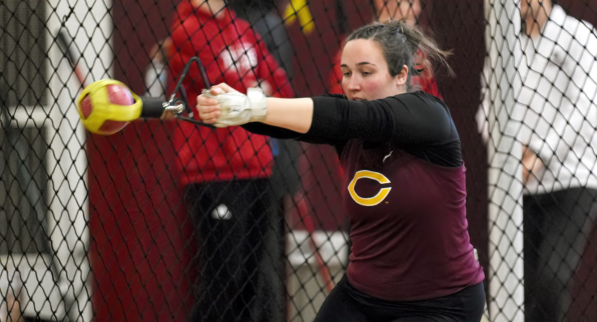 Allyson Kangas concentrates during the weight throw at the Cobber Open. She won both the weight throw and shot put at the meet.