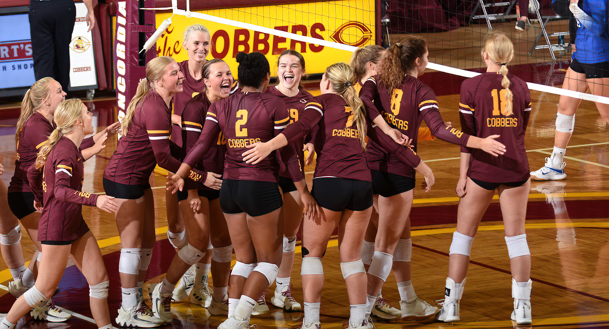 Concordia celebrates match point in their 3-1 win over Mayville State. Hannah Keil (#18) had the winner for the Cobbers.