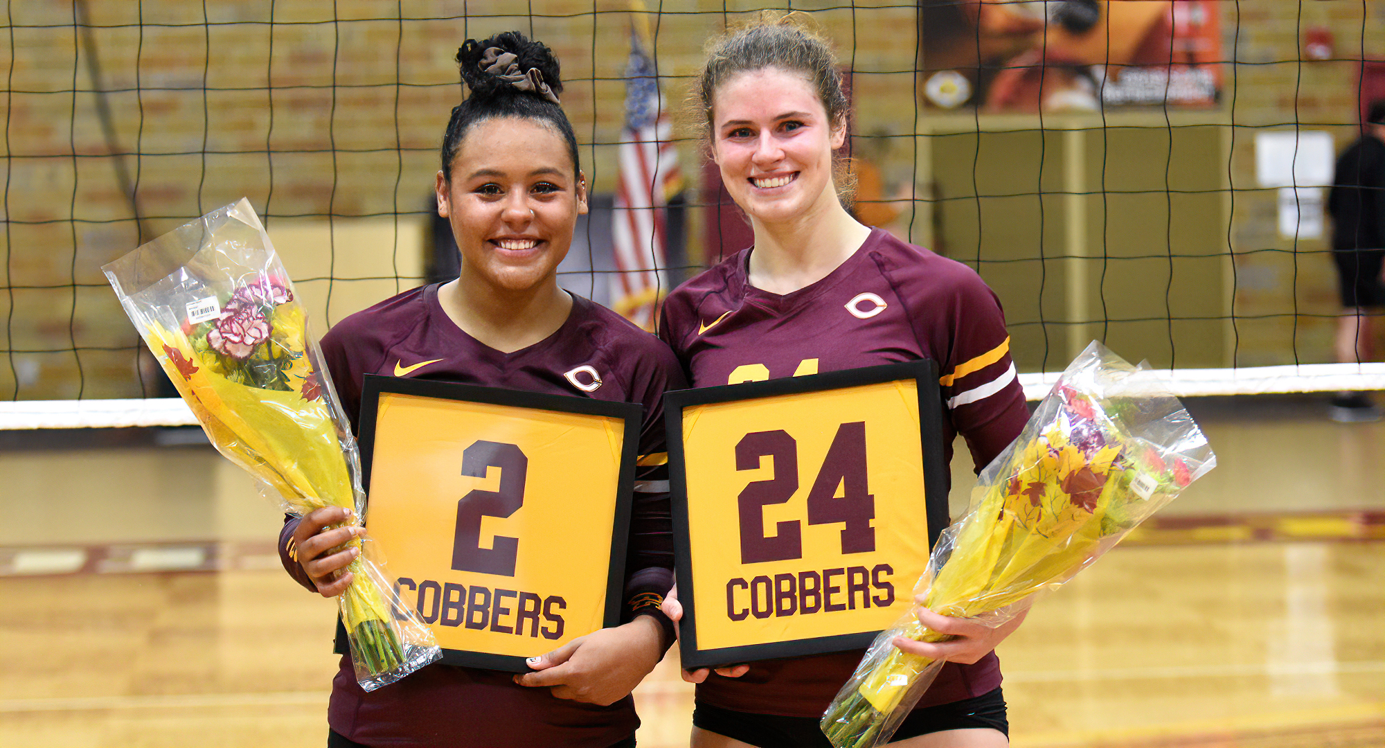Anna Brakke (L) and Kendra Wiggs were honored after the Cobbers' match with St. Olaf for the annual Senior Day celebration.